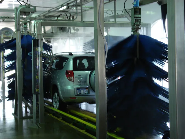 A picture of the interior of an Automatic Tunnel Car Wash in w:Grand Rapids, Michigan . Shown here, a Toyota RAV4 in the High pressure rinse stage, traveling on the conveyor, just beyond several wraps. Car wash software ranked: which ones earn a place