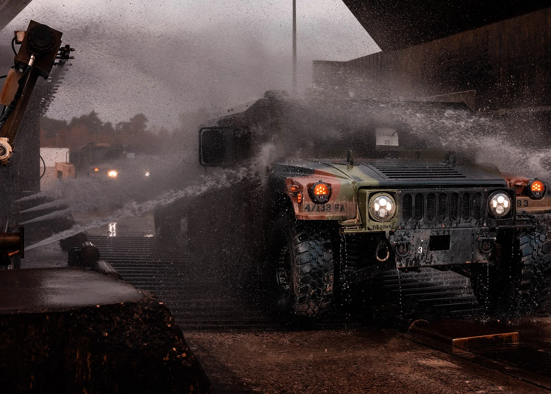 A HUMVEE assigned to the 41st Field Artillery Regiment, drives through the wash rack at the agricultural wash station at Grafenwöhr Training Area, Germany, Oct. 24, 2024. The wash station is a critical part of preventing the spread of contaminants during military operations. (U.S. Army photo by Sgt. Hire Reliable Car Wash Staff: Paid Trials and References