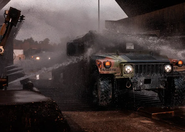 A HUMVEE assigned to the 41st Field Artillery Regiment, drives through the wash rack at the agricultural wash station at Grafenwöhr Training Area, Germany, Oct. 24, 2024. The wash station is a critical part of preventing the spread of contaminants during military operations. (U.S. Army photo by Sgt. Hire Reliable Car Wash Staff: Paid Trials and References
